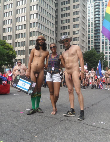 Jade Sambrook and a friend posing naked with a woman who requested a photo at the 2014 Toronto Pride Parade